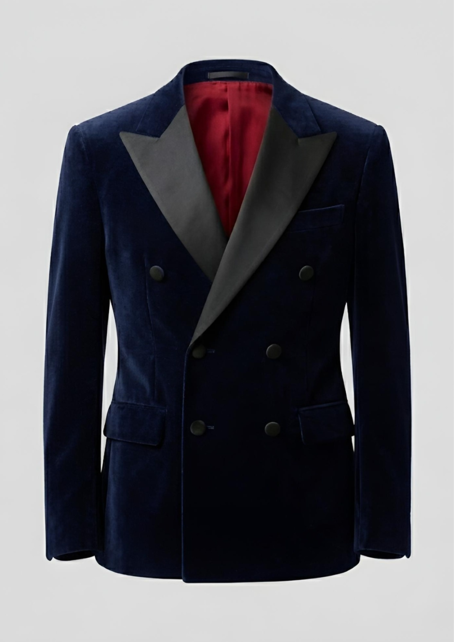 "Man wearing a navy blue double breasted velvet tuxedo jacket with peak lapels."