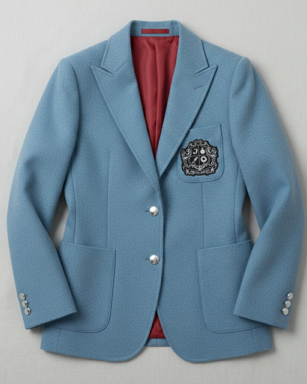 Women’s blue all-season wool blazer with silver buttons and collegiate crest.
