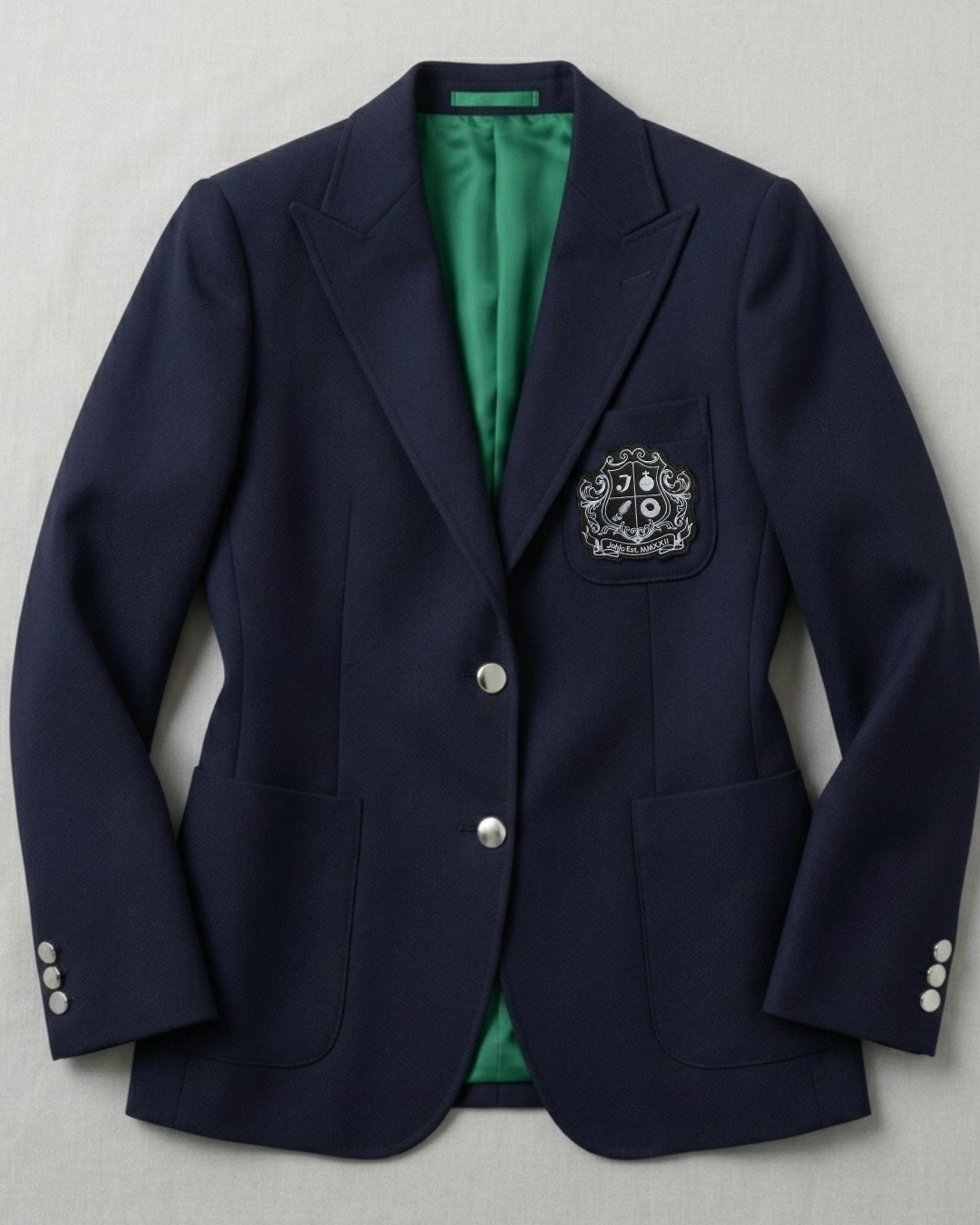 Women’s blue all-season wool blazer with silver buttons and collegiate crest.