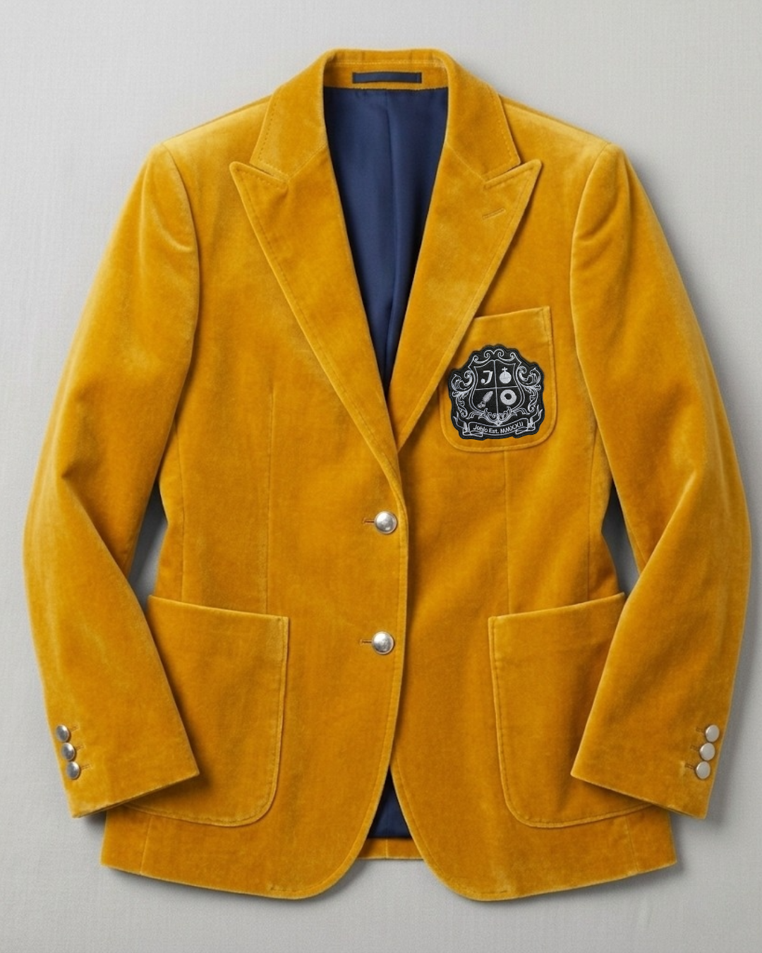 Yellow velvet women's blazer with silver buttons and embroidered crest.
