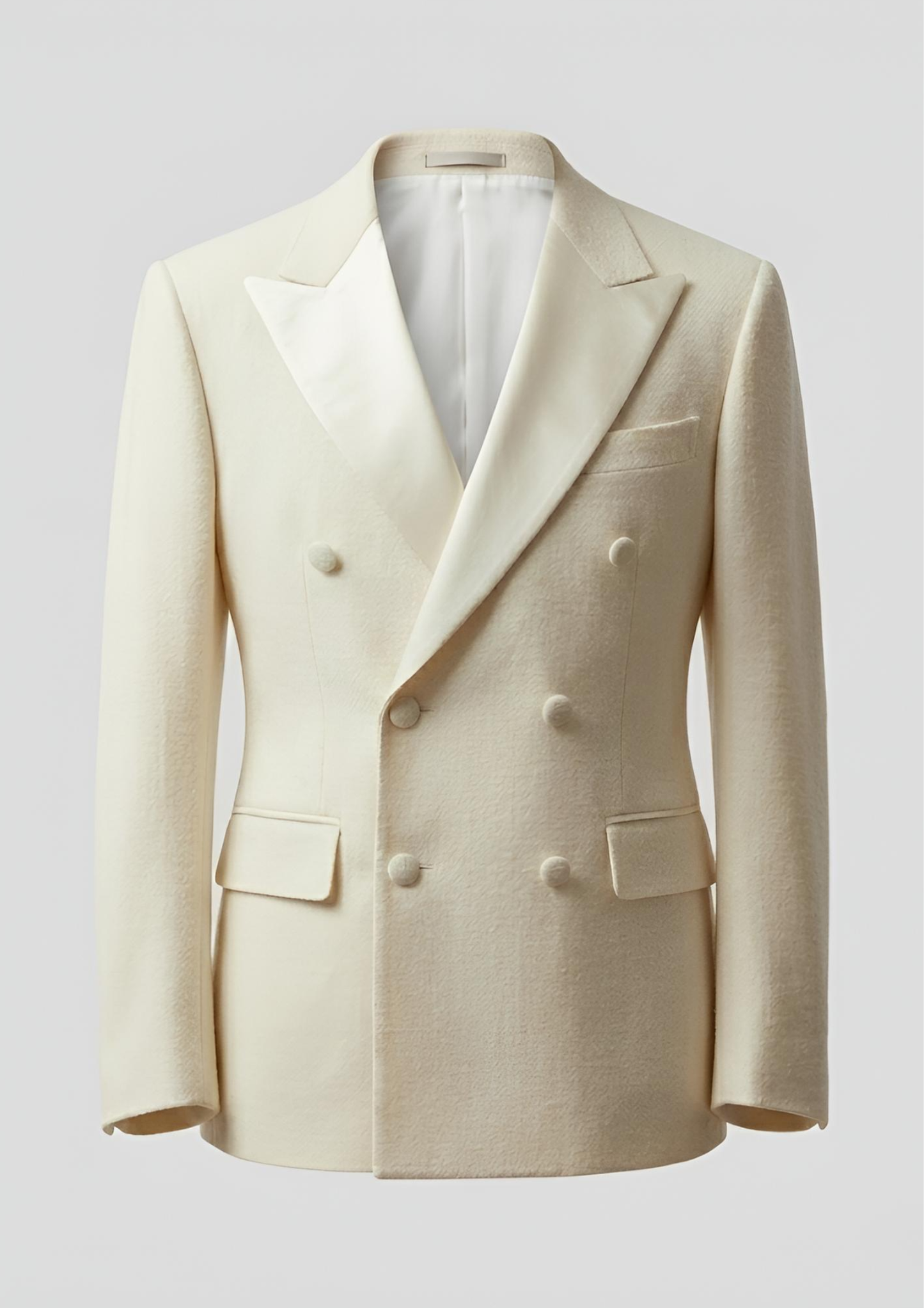 "Man wearing a white double breasted velvet tuxedo jacket with peak lapels."