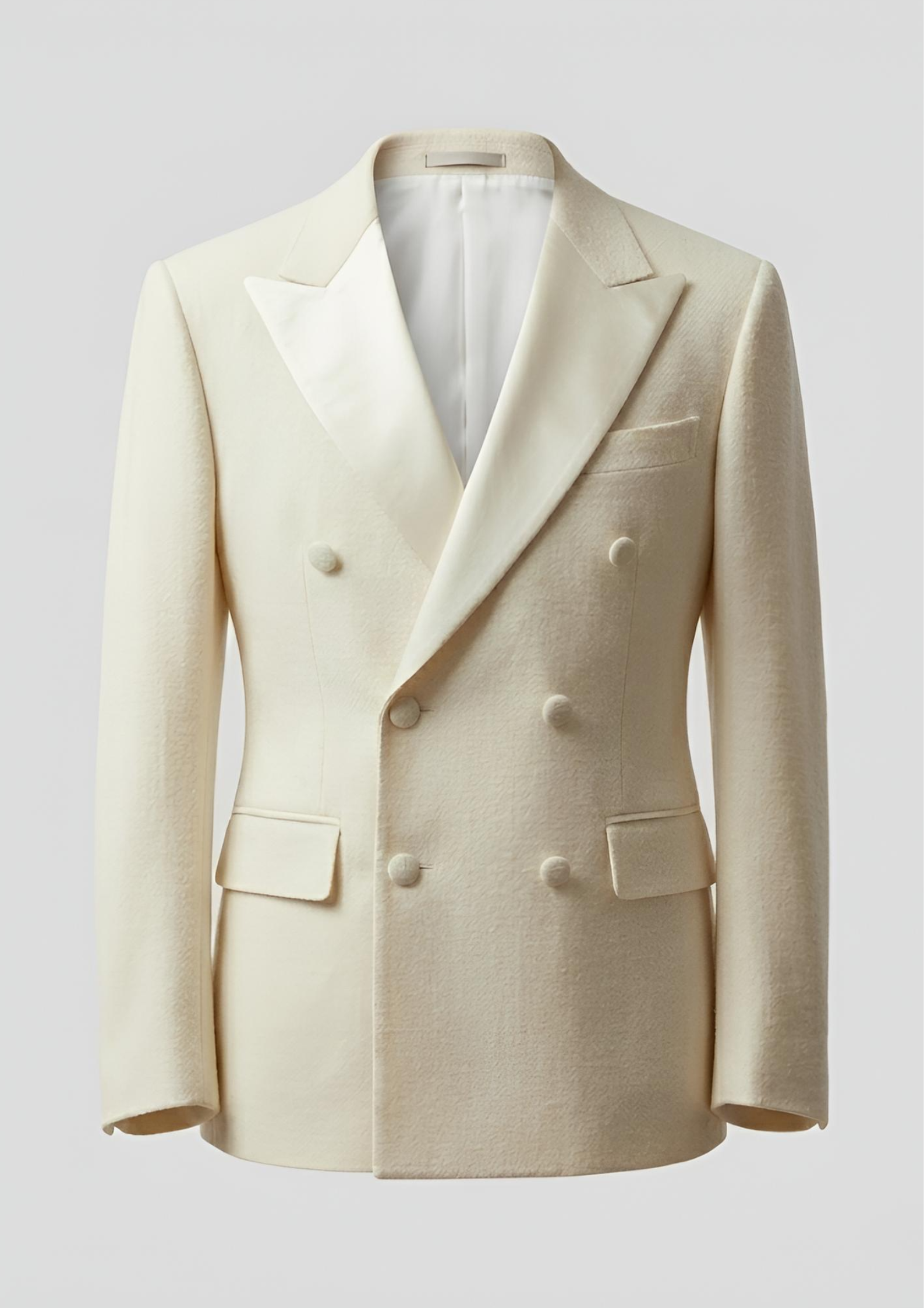 "Man wearing a white double breasted velvet tuxedo jacket with peak lapels."