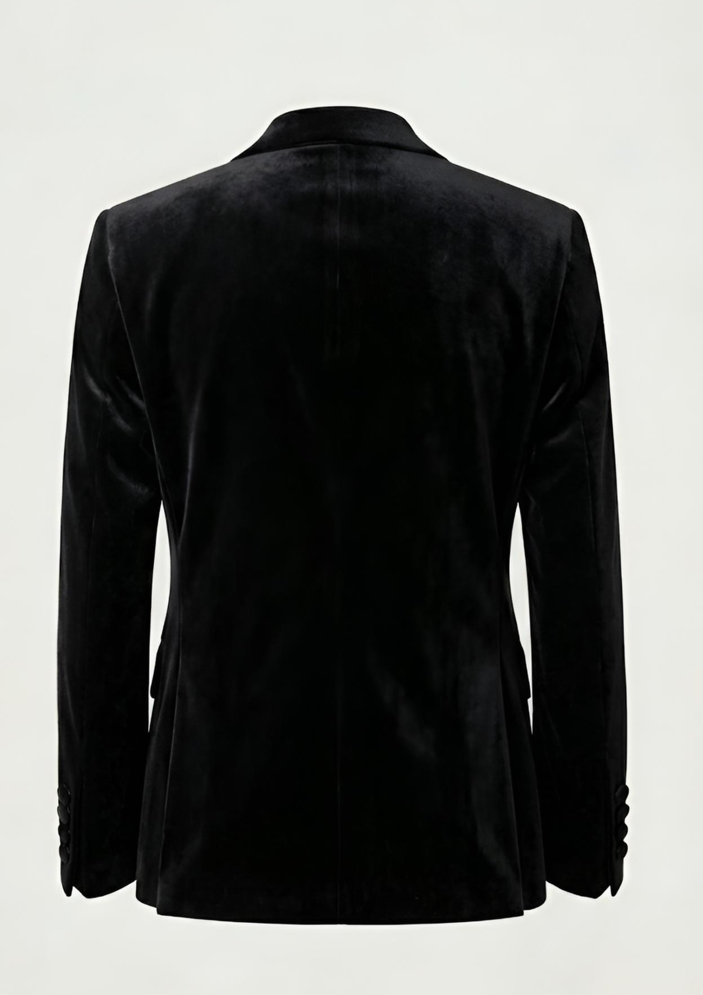 "Man wearing a black double breasted velvet tuxedo jacket with peak lapels."