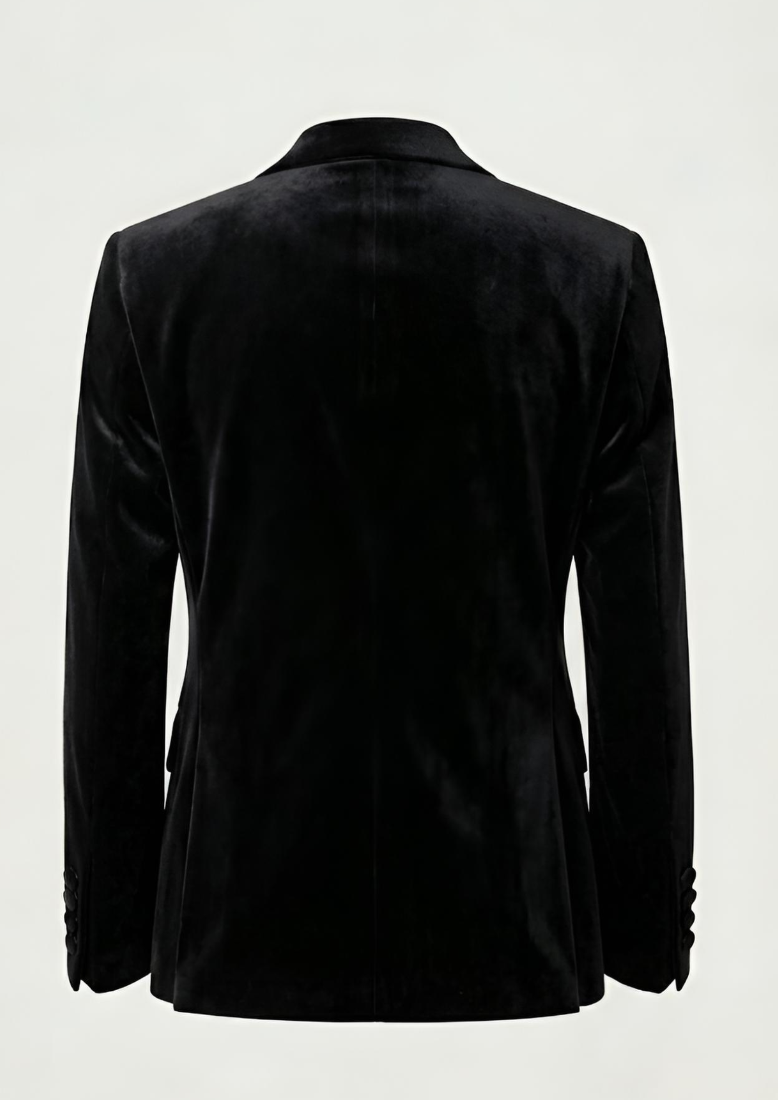 "Man wearing a black double breasted velvet tuxedo jacket with peak lapels."