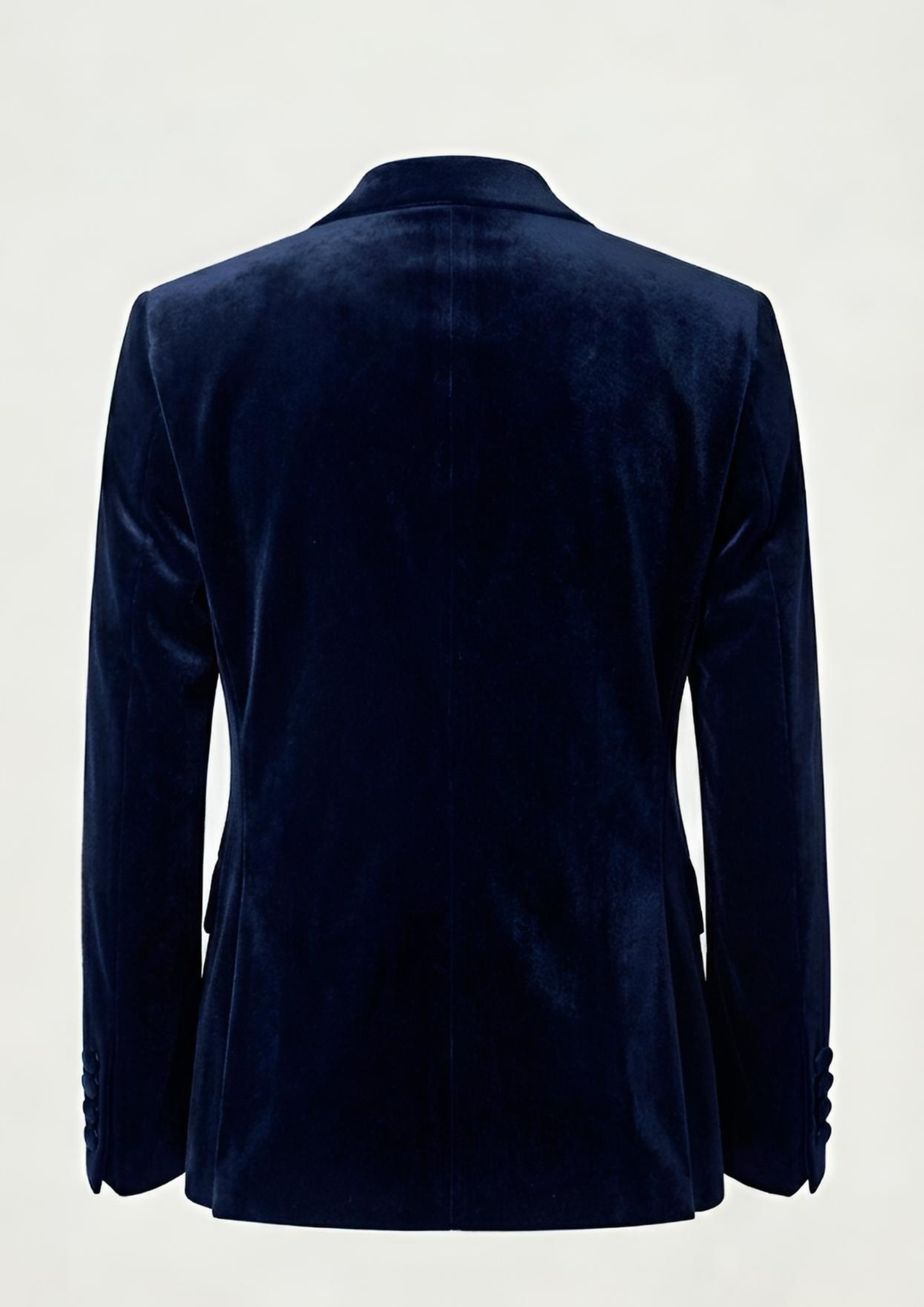 "Man wearing a navy blue double breasted velvet tuxedo jacket with peak lapels."