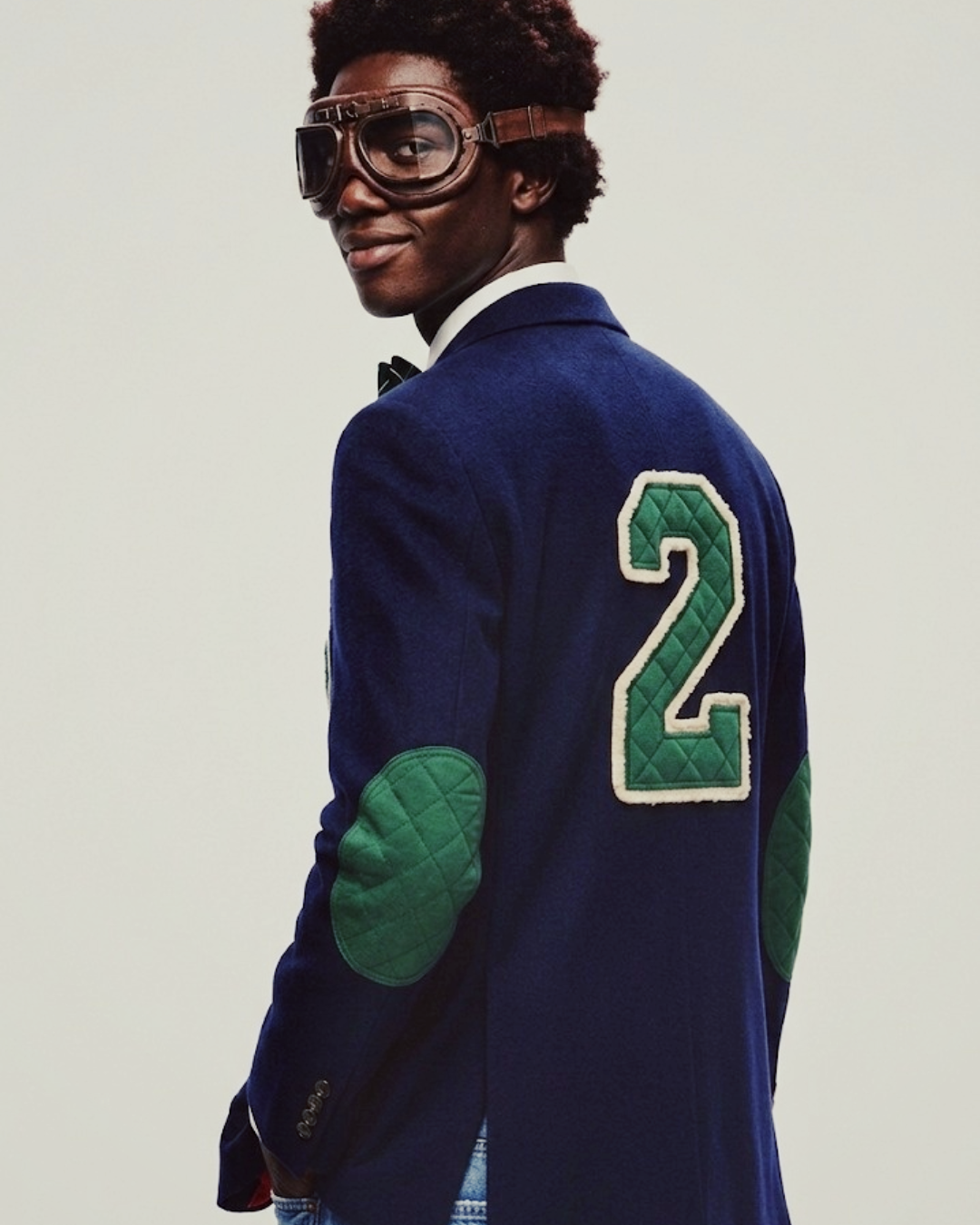 Front view of model wearing Navy Blue Wool-Blend Varsity Blazer with navy chenille patch.