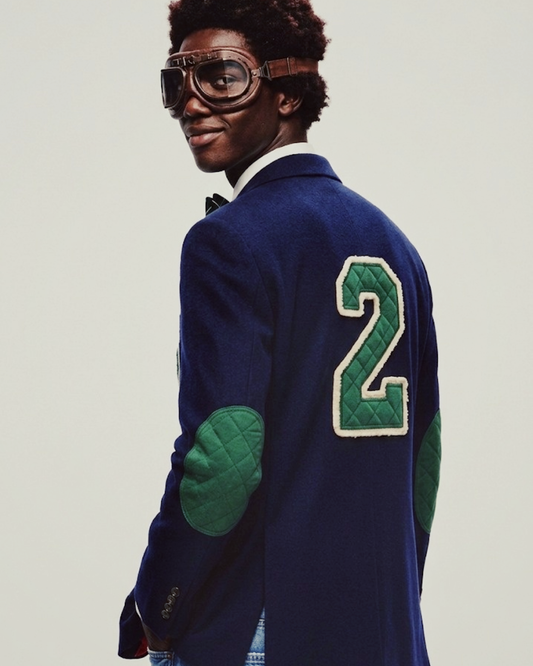 Front view of model wearing Navy Blue Wool-Blend Varsity Blazer with navy chenille patch.